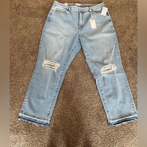 Good American released hem vintage jeans. Straight leg with flat tummy tuck.
